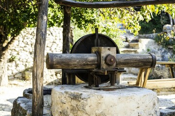 Ancient Nut Press A historical nut oil press in a rustic village setting