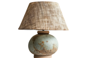 Artisan ceramic lamp with textured shade, enhancing a cozy living space with a blend of earthy tones and modern design elements isolated on transparent background