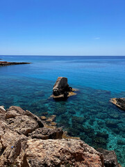 Turquoise water in Cyprus under blue sky
