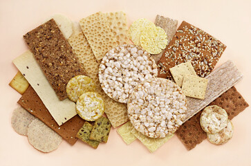 Colorful mix of crispbread varieties. Food snacks for healthy diet background.