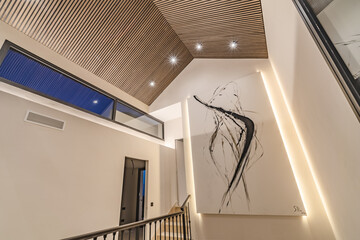 an image of a large piece of illuminated art hanging in a refurbished luxury mediterranean holiday home 