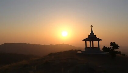Fototapeta premium Sunset Silhouette Of A Hilltop Gazebo With A Cross