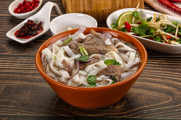 Vietnamese Pho Bo soup with beef and noodles