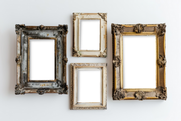 Four intricately designed vintage frames rest on a minimalistic white wall, inviting personal photos or artwork to adorn their empty spaces with elegance