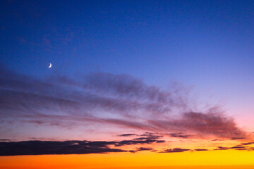 sunset over the mountains. Crescent Moon and Venus Conjunction