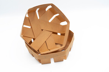 Empty round small wooden box on a white background. A small birch bark basket for fruits, berries,...