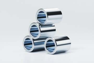 Four shiny metal rings stacked in a pyramid shape against a white background.