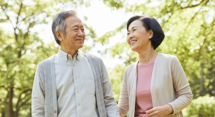 Man and a woman are walking together in a park