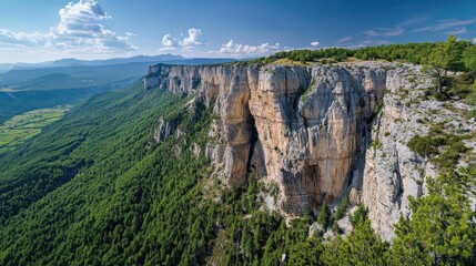 Majestic cliff overlooking valley, sunny day, mountains background, nature landscape for travel brochures