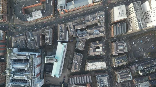 Aerial drone shot across Manchester shot from the west looking east at Deansgate Square, Manchester, UK