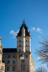Obraz premium Majestic tower piercing the clear blue sky in a historic European city