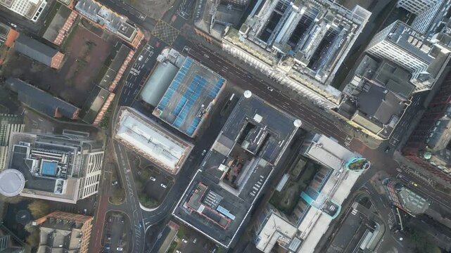 Aerial drone shot across Manchester shot from the west looking east at Deansgate Square, Manchester, UK