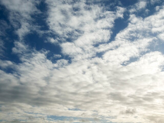 Warm cloudy blue sky. Nature background for design or sky replacement.