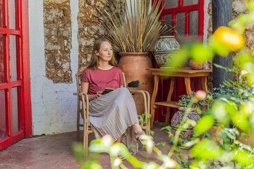 Female tourist in a colonial house in San Cristobal de las Casas, Mexico. Cultural exploration, architecture, and travel experience concept