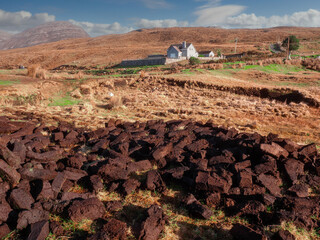 Turf briquets drying up on a sun. Traditional burning fuel in Ireland gathered in pea bogs....