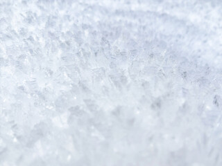 close-up of ice crystals pattern. frosty pattern. nature pattern. frozen water texture. winter frost. ice texture. white minimalistic background