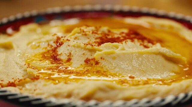 Hummus close-up, middle eastern national traditional food. Muslim family dinner, Ramadan, iftar. Arabian cuisine delivery. 