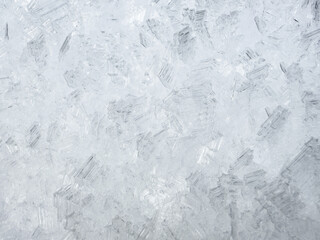 Obraz premium close-up of ice crystals pattern. frosty pattern. nature pattern. frozen water texture. winter frost. ice texture. white minimalistic background