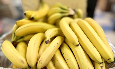 Ripe juicy yellow bananas close-up on a shelf in a supermarket. Close-up