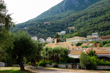 Barbati, Corfu. In a picturesque residential area, there is a stunning mountain that looms majestically in the background, adding to the beauty of the location.