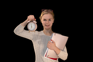 Smiling Student Holding Alarm Clock and Notebooks on Black Background