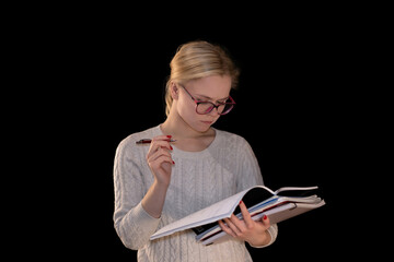 Focused Young Woman Studying with Notes and Pen