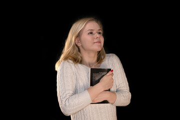 Happy Woman Embracing a Book with Joyful Expression