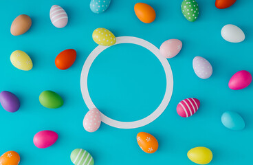 Colorful pattern composition made of various colored Easter eggs on light blue background with copy space. Minimal Easter concept. Creative festive spring holiday layout. Flat lay, top of view.