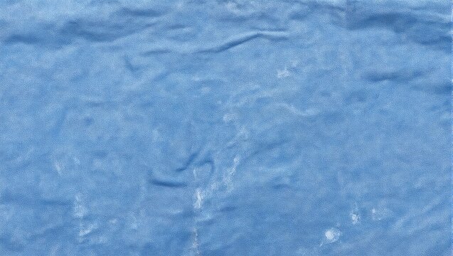 Soft blue chambray fabric with faded creases offering a comfortable and casual look