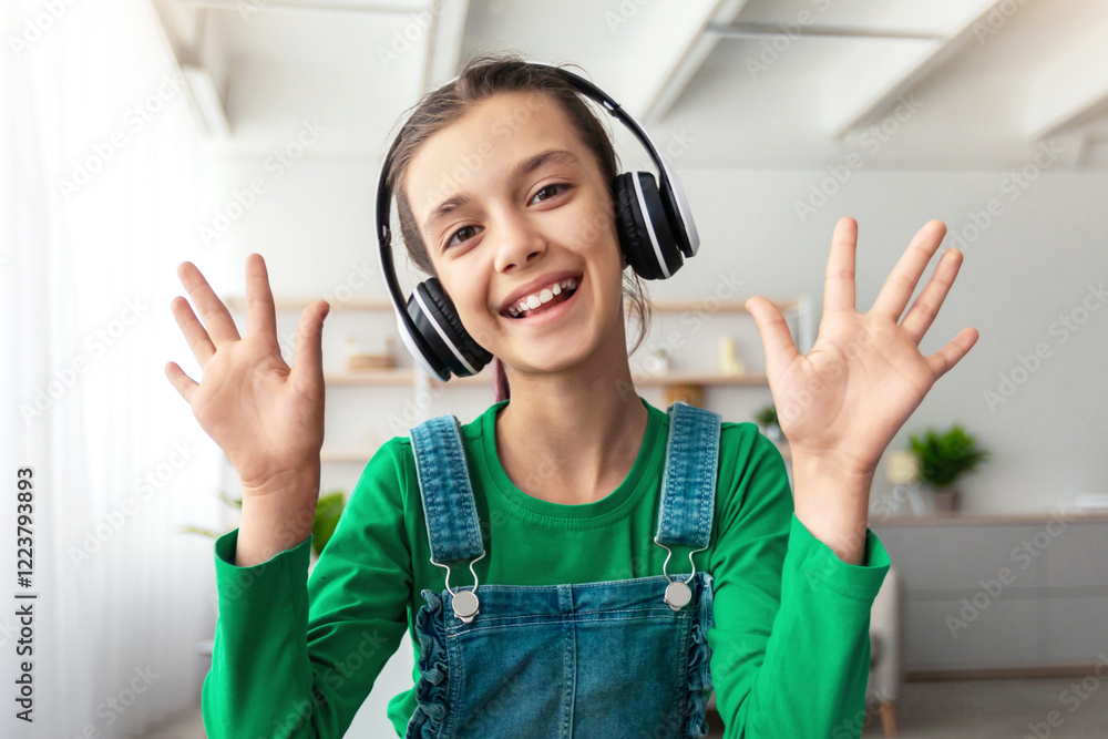 Poster e-learning. portrait of smiling school girl making video call with teacher and classmates, using pc.