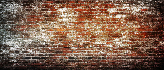Obraz premium Old brick wall. Texture of a red brick wall with crumbling plaster. Brick grunge background.