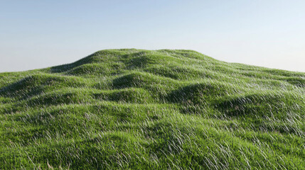 Obraz premium Lush green hills under a clear blue sky, showcasing vibrant grass swaying gently in the breeze