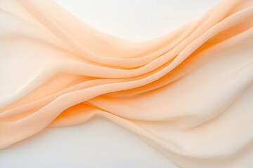 Flowing fabric in soft peach and cream hues, creating a gentle wave effect on a white background