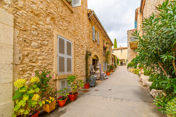 Naklejka premium A picturesque, narrow stone alley in the medieval hilltop village of Gourdon, in the Alpes-Maritime section of Southern France. 