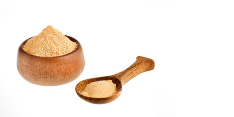 Organic Peruvian maca powder in the bowl and spoon - Lepidium meyenii