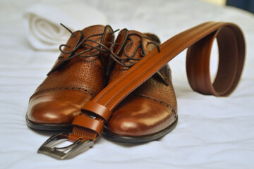 Belt, shoes and wedding rings ready for the groom and for the wedding