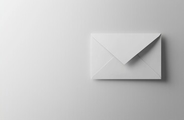 Closed white envelope lying on a white background creating a minimalist and elegant composition, ideal for communication, invitation, or message concepts
