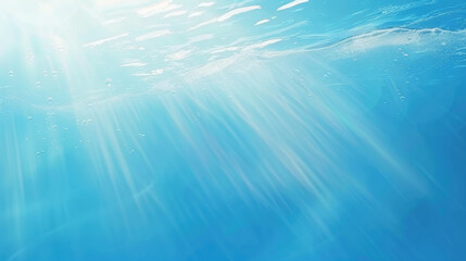 Underwater scene with sunlight rays and bubbles in clear blue water
