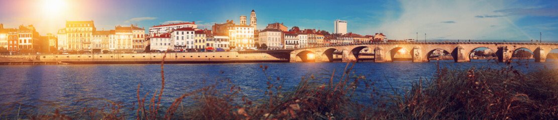 Panoramic view of city of Macon with Saone river on sunny autumn day, Burgundy, France..