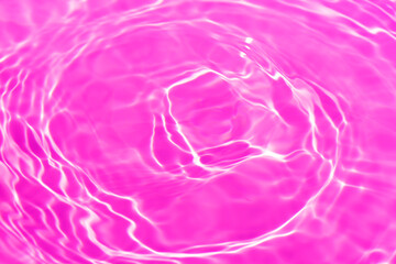 Purple water bubbles on the surface ripples. Defocus blurred transparent pink colored clear calm...