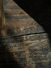Shadows across a wooden floor