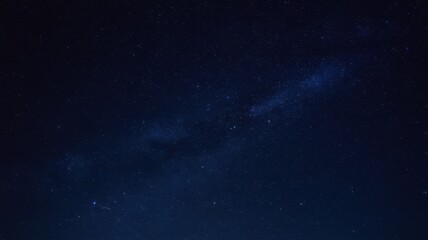 A stunning view of a starry night sky filled with twinkling stars and a hint of the Milky Way, creating a serene and captivating atmosphere.