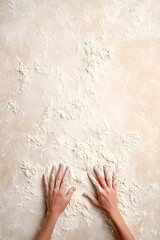 Fototapeta premium Hands Kneading Dough on a Floury Surface