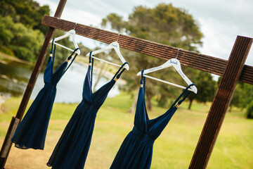 a group of bridesmaids in purple dresses standing on a wooden platform
