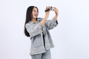 Woman Holds Camcorder, Records Video Content Enthusiastically, and Captures Memories Joyfully on...