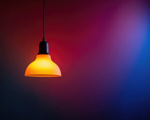 Fototapeta premium Atmospheric Photograph of a Vibrant Orange Hanging Lamp with Colorful Gradient Background for Modern Design Inspiration