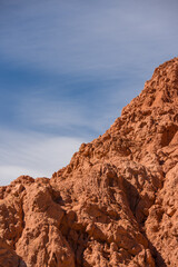 Rocky desert formations colorful red mountain with a blue sky 