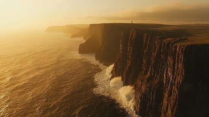 Dramatic sunset over majestic cliffs, waves crashing against the rocks.