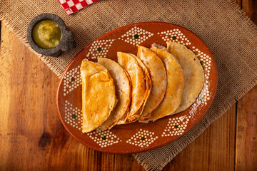 Tacos de Canasta, "basket tacos" also known as Tacos Sudados, are a typical fast food from Mexico. They are made with corn tortillas and can be filled with potatoes, beans, mole, adobo or pork rinds.