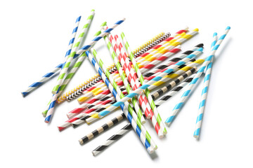 Different paper drinking straws on white background